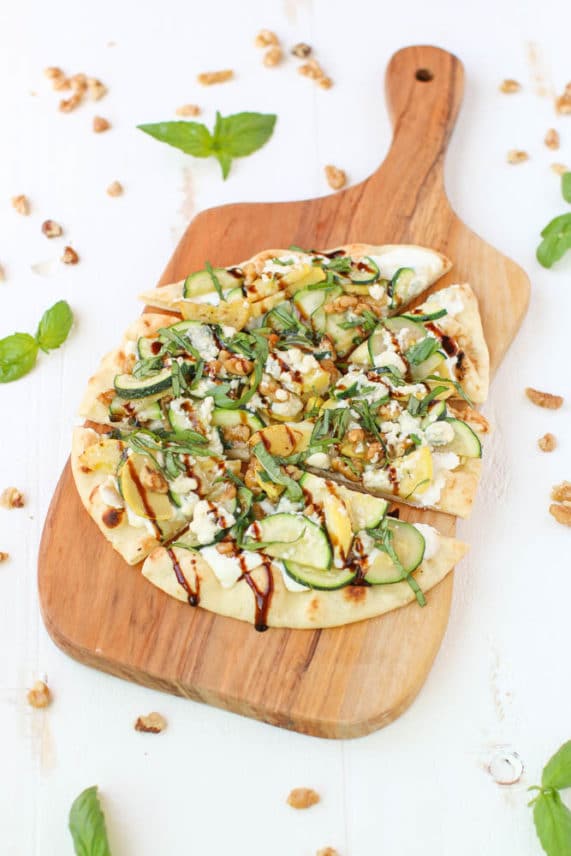 Fresh cut tray of Summer Squash and Blue Cheese Flatbread