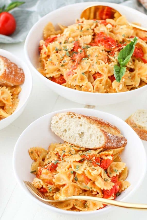 Bowl of Baked Feta Pasta with bread