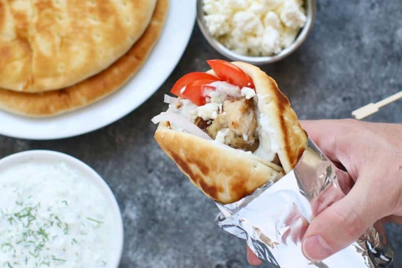 Topping Authentic Greek Souvlaki with Feta Cheese Crumbles