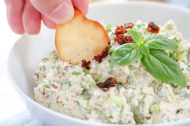 Grabbing a swipe of Mediterranean Feta Dip