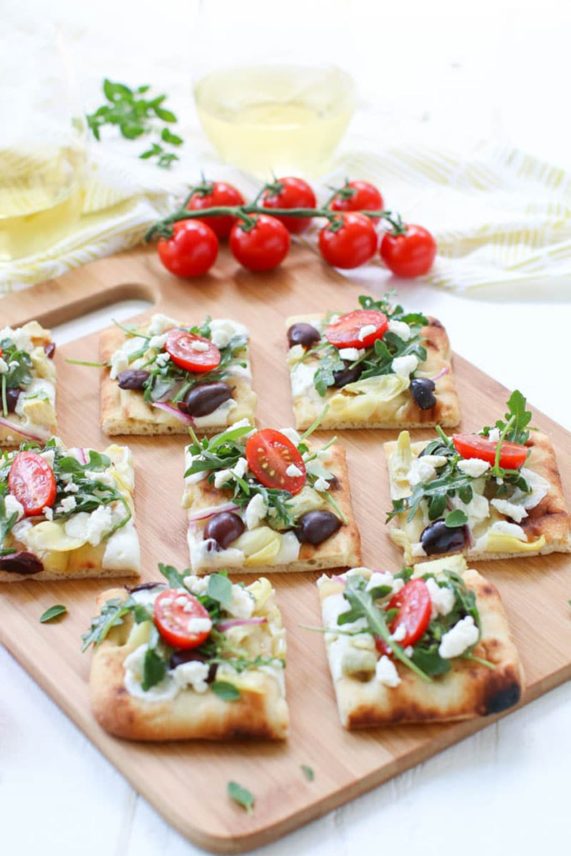 Cutting up a batch of Greek Salad Flatbread