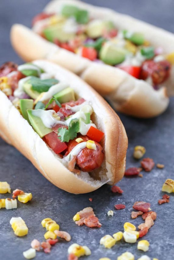 Pair of fully loaded Tex-Mex Hot Dogs