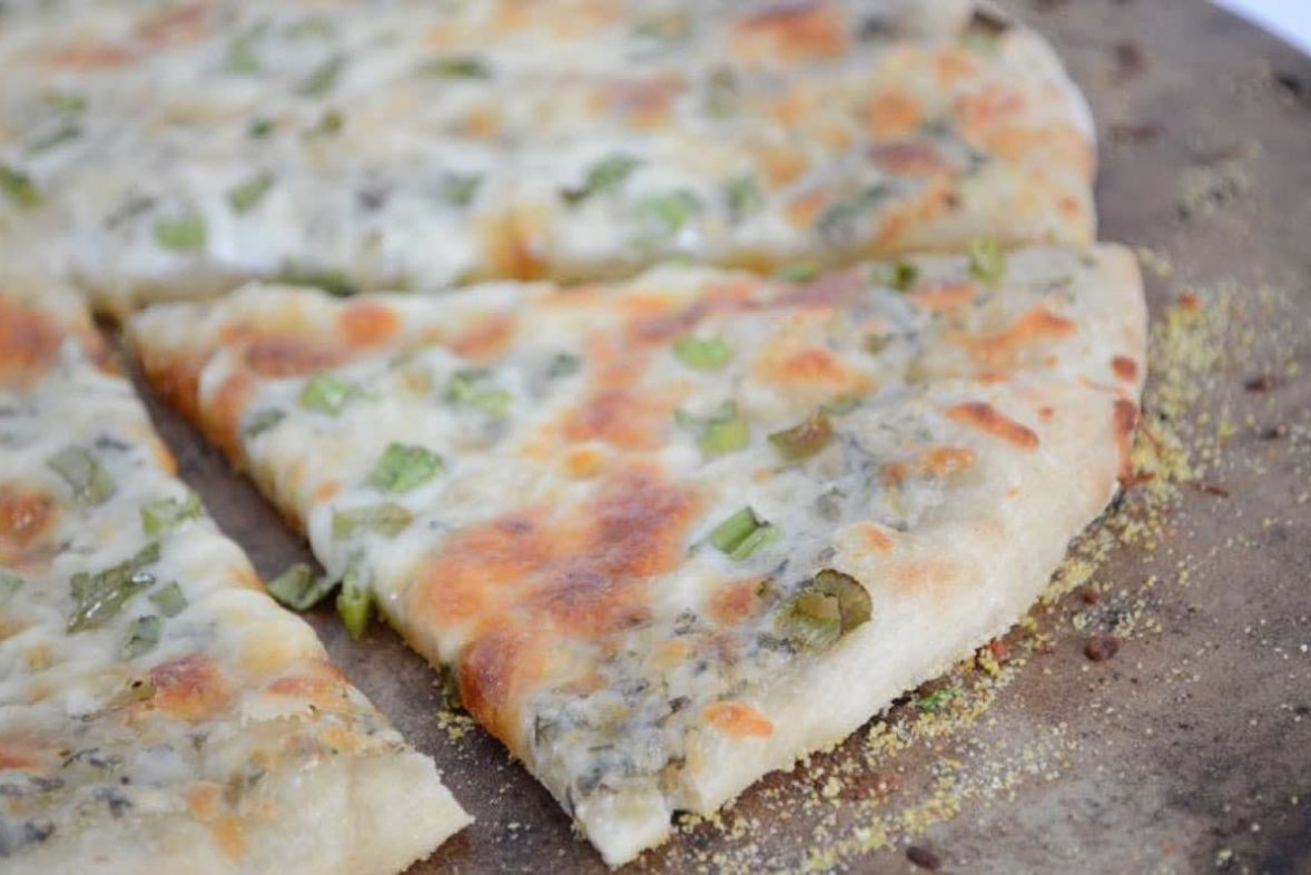 Freshly baked White Spinach and Parmesan Pizza