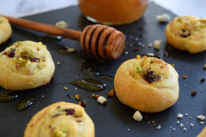 Blue Cheese Crumbles, Cherry & Pistachio Crescent Pinwheels with Honey