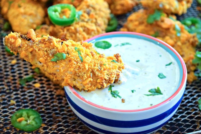 Dipping Jalapeno Cheddar Chicken Tenders in Homestyle Ranch