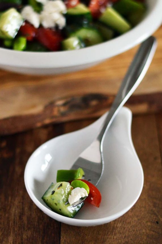 Taking a scoop of Edamame Greek Salad