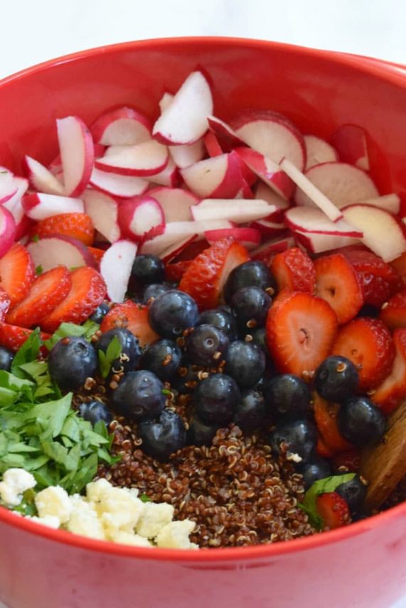 Fresh Berry and Blue Cheese Quinoa Salad ingredients in the mixing bowl