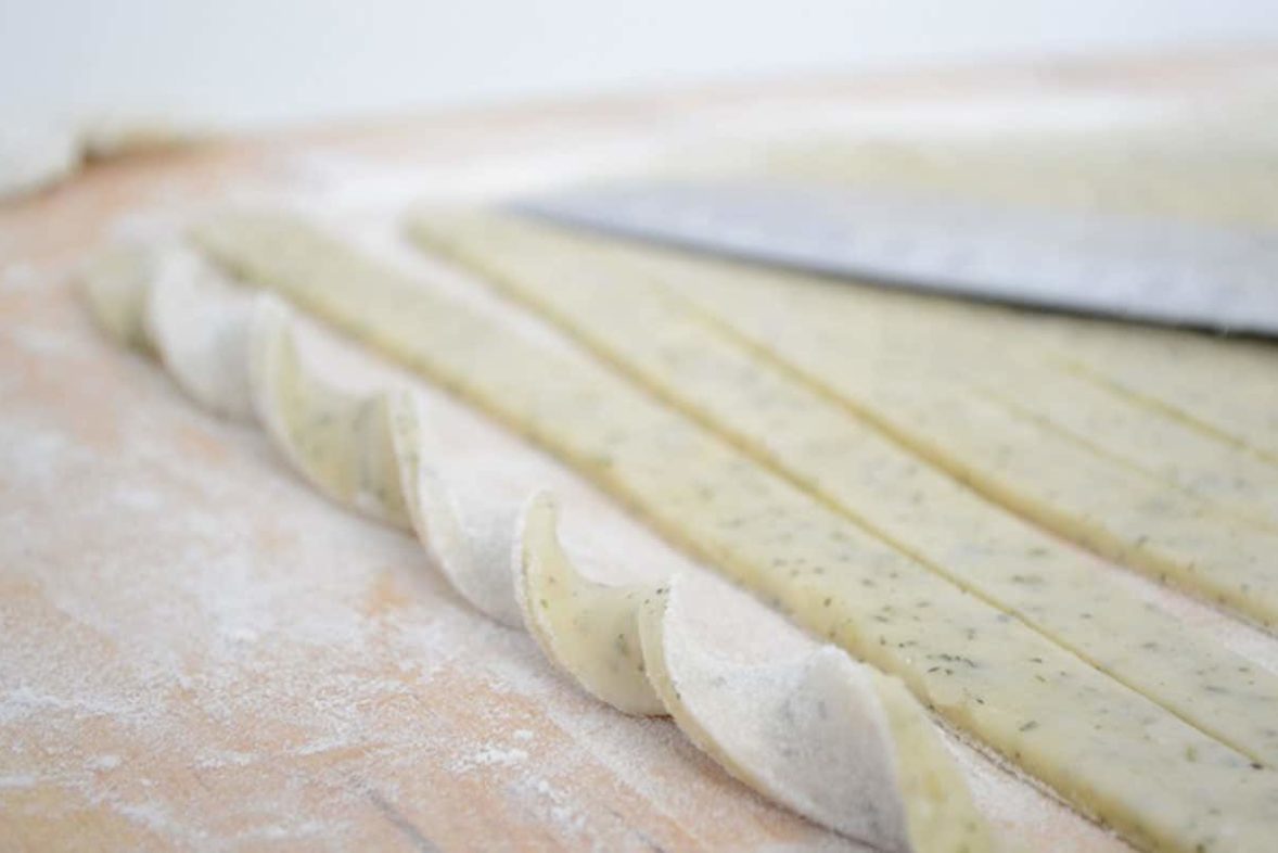 Rolling up a batch of Herbed Parmesan Cheese Straws