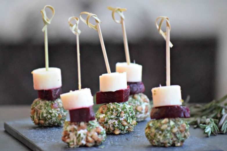 Array of One-Bite Gorgonzola Pecan Cheese Balls with Beets & Palm Hearts