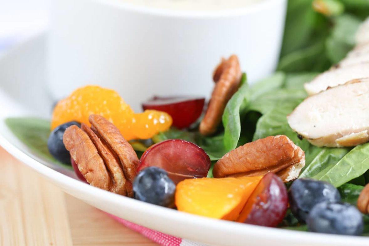 Serving up a large bowl of Summer Poppy Seed Salad