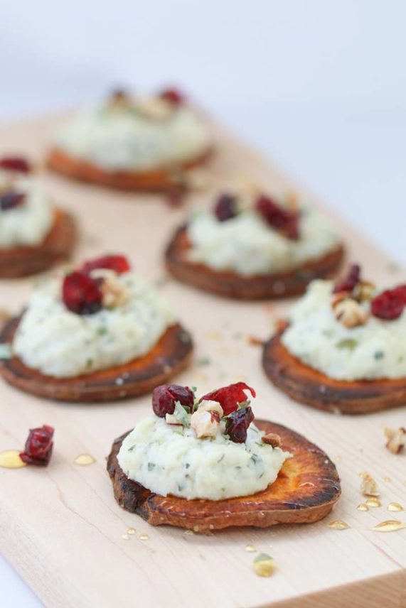Adding the finishing touches to Sweet Potato and Herbed Ricotta Rounds