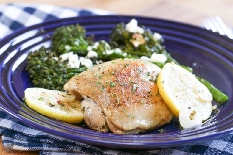 Plate of Braised Chicken Thighs with Roasted Broccolini and Feta