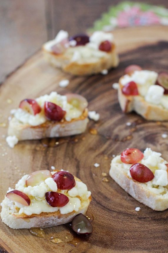 Array of Gorgonzola, Grape and Honey Crostini