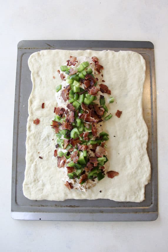 Adding the filling to Buffalo Blue Cheese and Chicken Bacon Ranch Braids